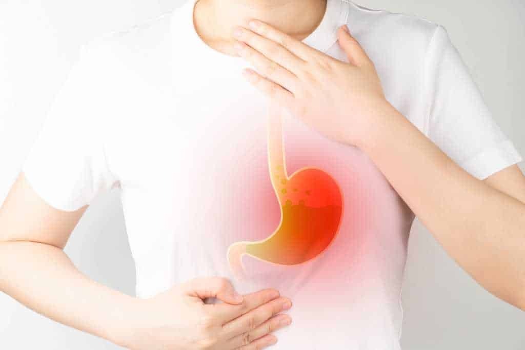 a person holding his stomach and